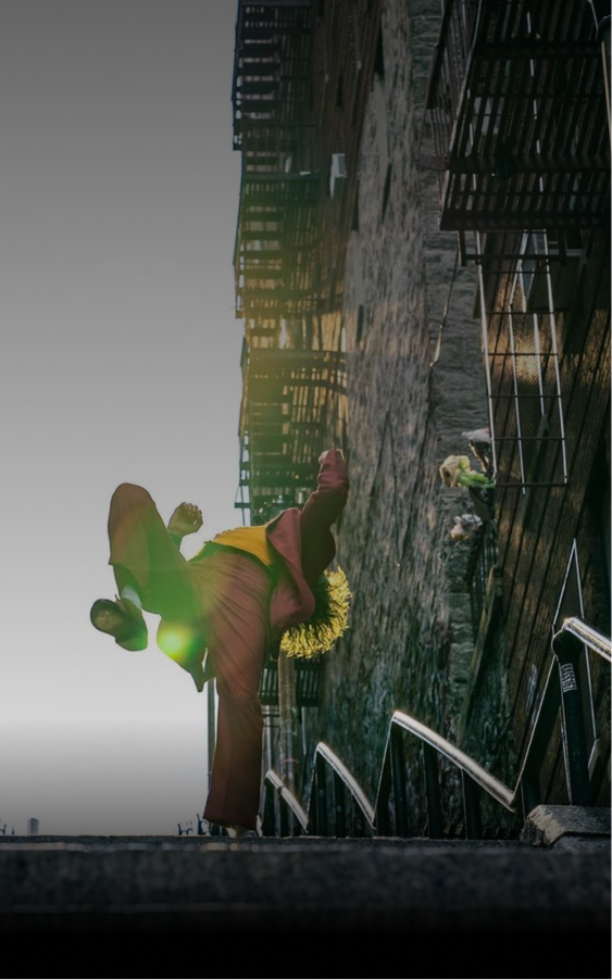 An image Joker dancing down some stairs